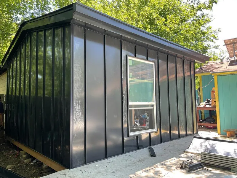 Black standing seam metal wall panels for Roof Inspection in Greenwich